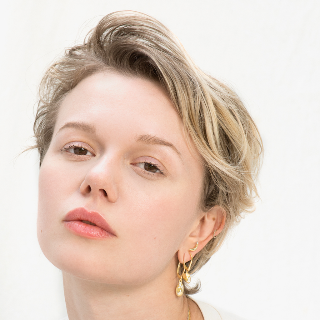 Model shot of A-Peel To Equality gold-plated Banana Stud Earrings by Pavé The Way® Jewelry 