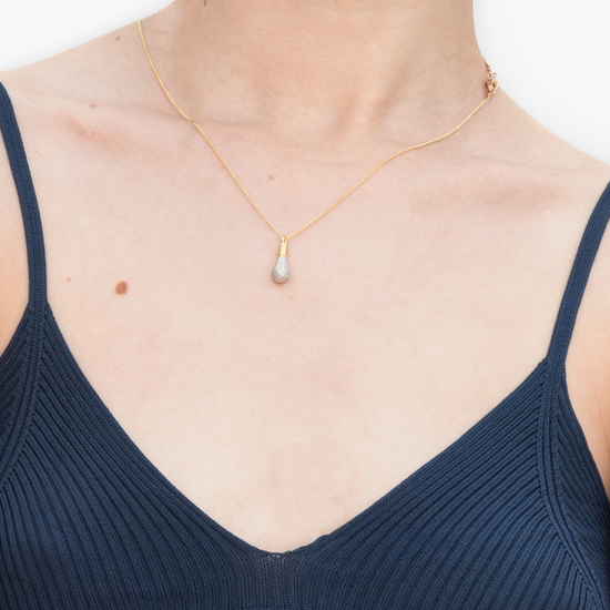 Model wears Genius! gold-plated Light Bulb necklace by Pavé The Way® Jewelry