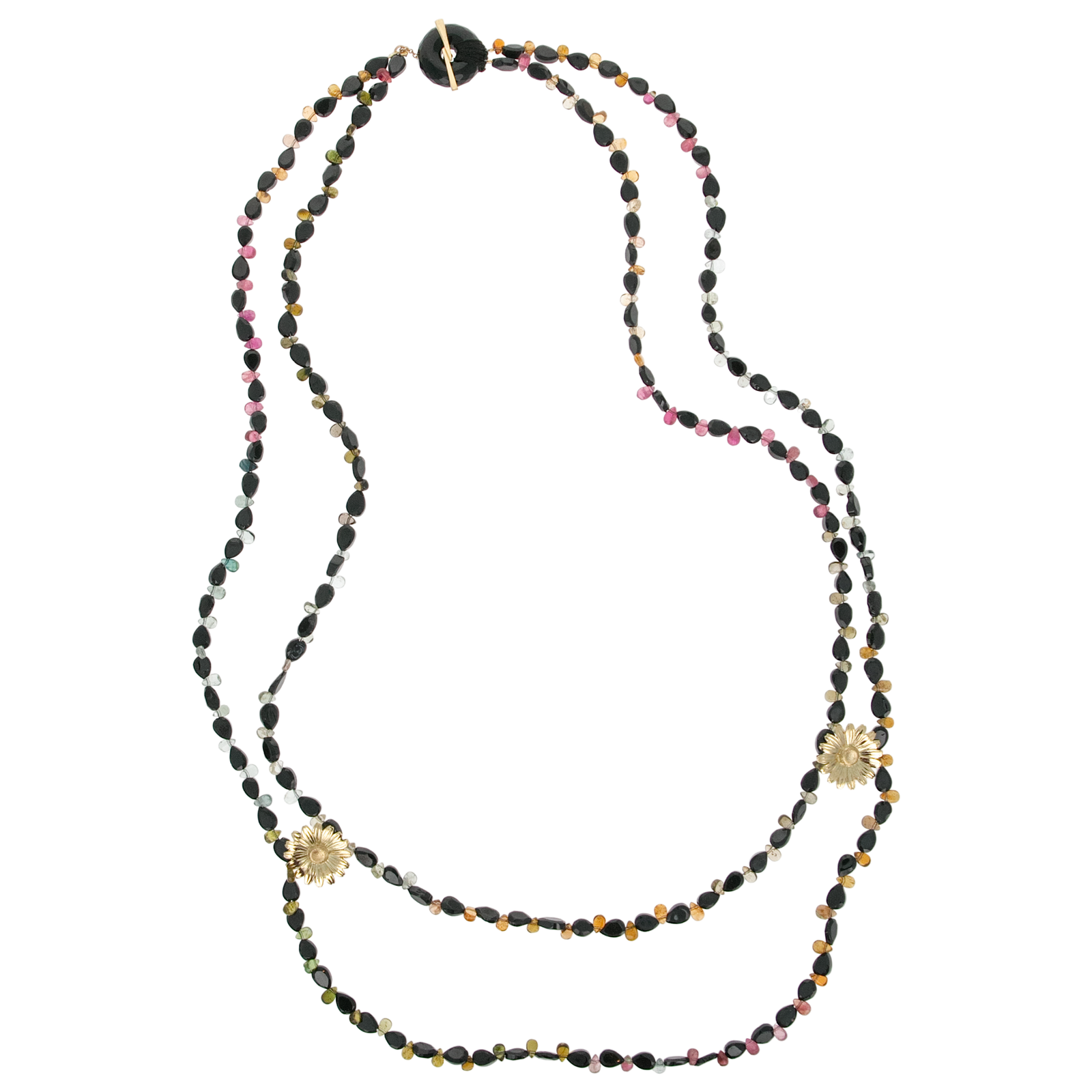 A woman wearing a double-strand beaded necklace with gold floral accents and dark iridescent beads, paired with a black tank top against a light gray background.