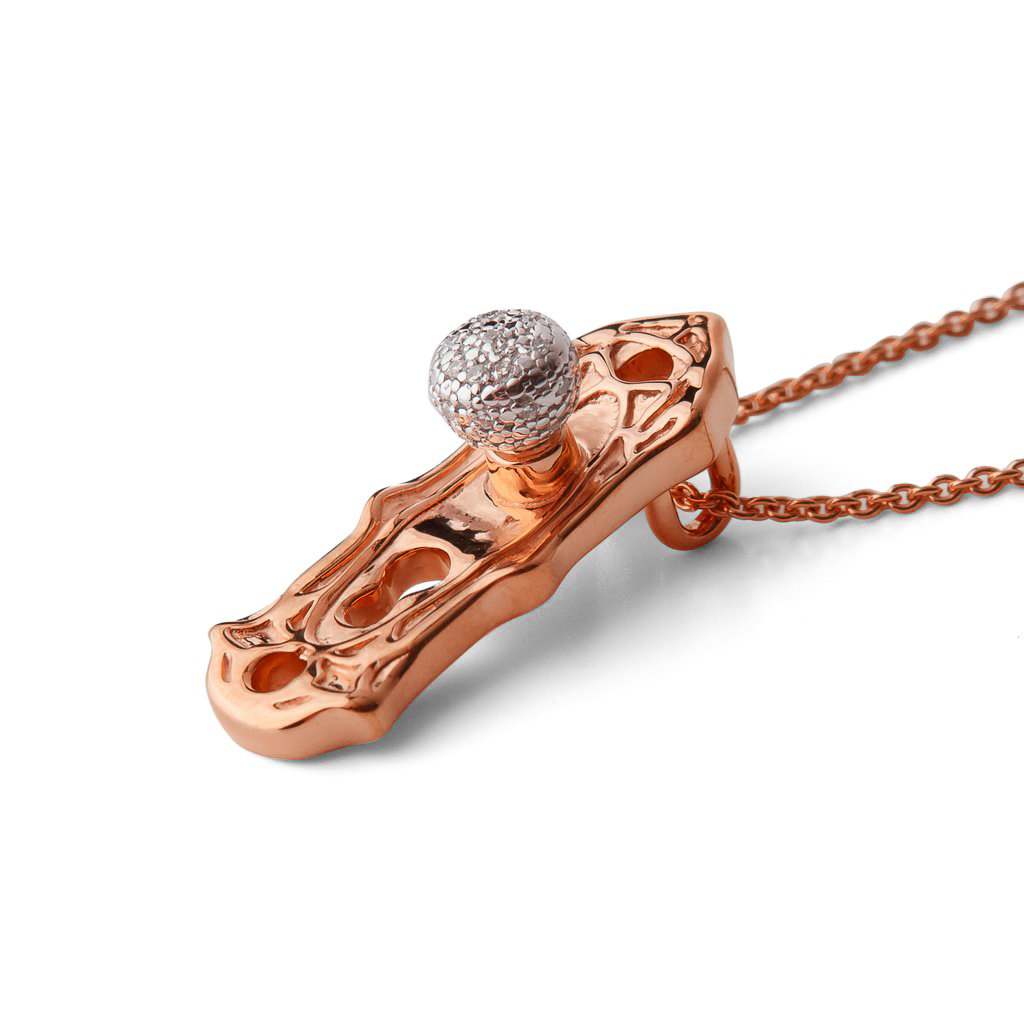 Side view of Check Your Bias At The Door rose gold-plated Door knob necklace by Pavé The Way® Jewelry