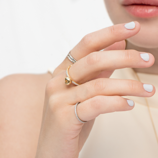 Model wears Equal To The Core gold-plated Apple ring with diamond stackable bands by Pavé The Way® Jewelry