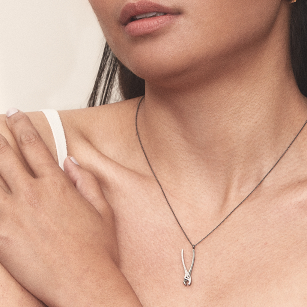 Load image into Gallery viewer, Model wears Get A Grip Pliers necklace by Pavé The Way® Jewelry

